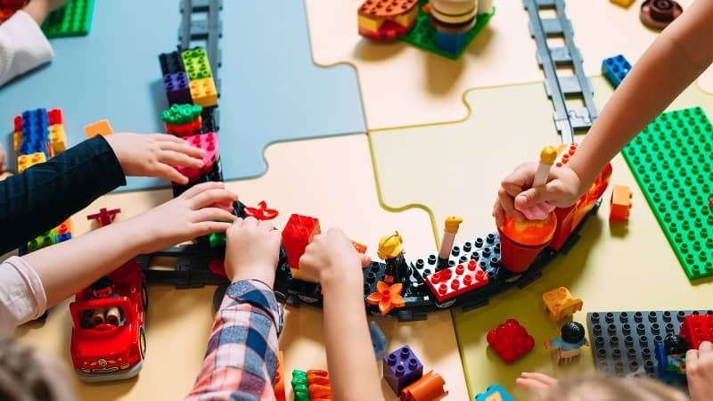 Children playing with Lego train